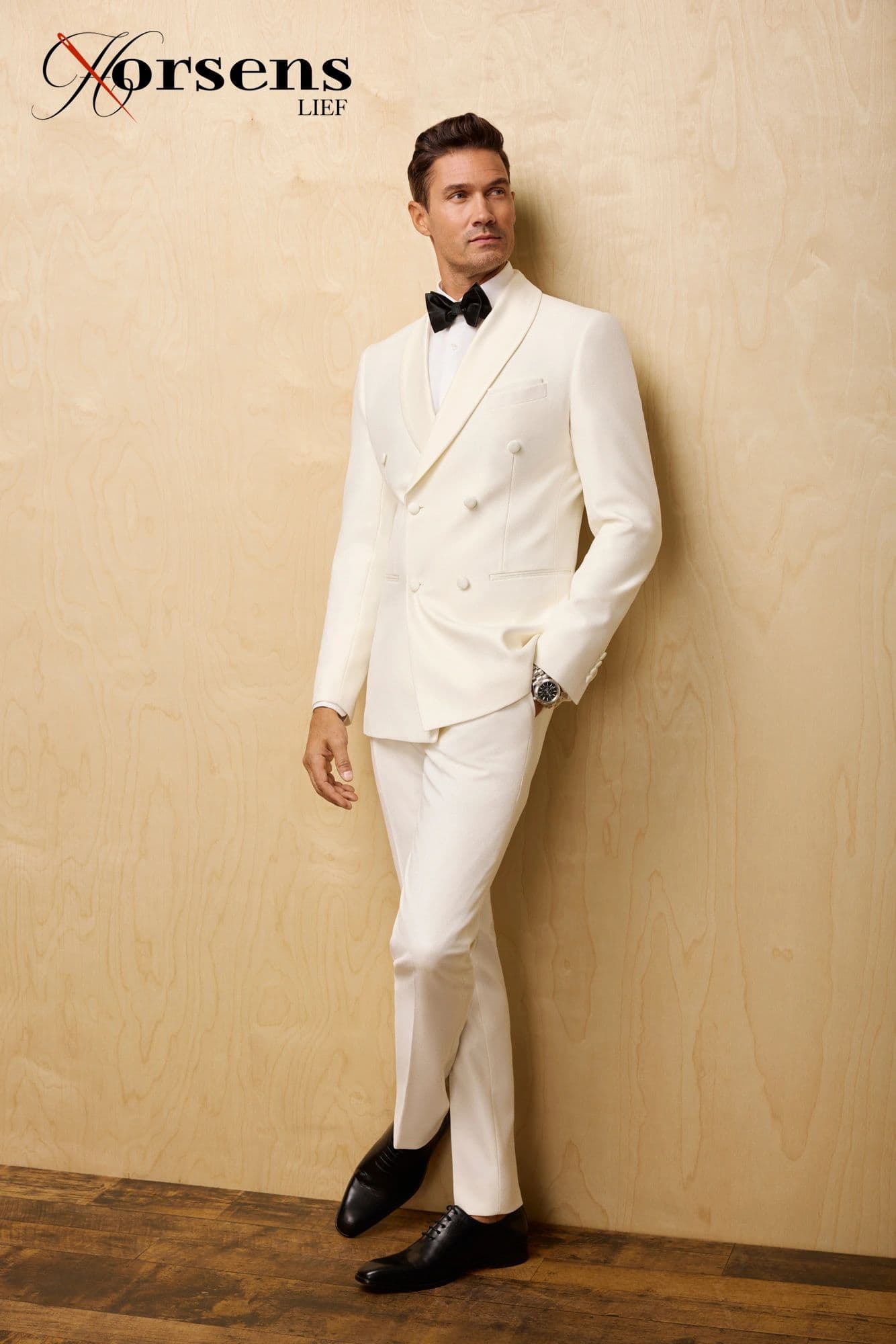 Ivory double-breasted tuxedo & black bow tie